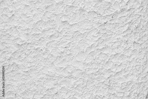 Rough white relief stucco wall texture background. blank for designer,light wall, white cement
