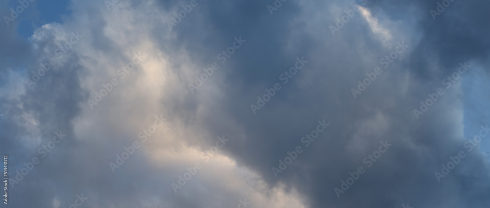 Background from storm clouds on the blue sky.