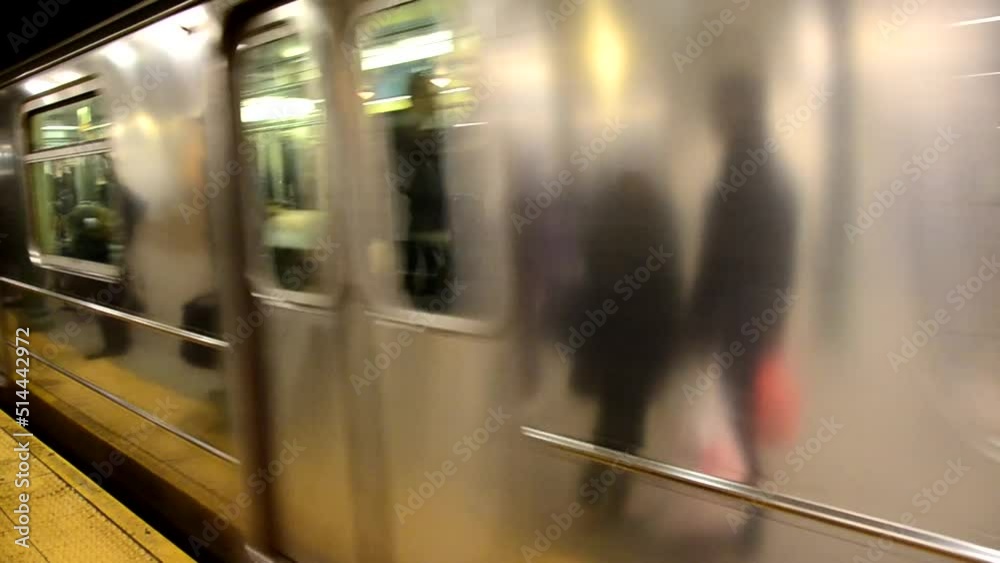 Close up of NYC subway train passing platform. NYC Subway in Motion. Speeding Through the Station: NYC Subway