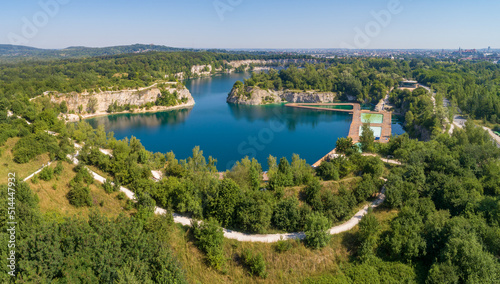 Kraków, Poland. Zakrzówek lake with steep cliffs in place of former flooded limestone quarry. Recreational place with swimming pools, restaurants and other facilities under construction. Aerial view © kilhan