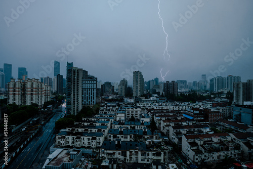 city skyline with lightning during thunderstorm and cloudy sky, shanghai china