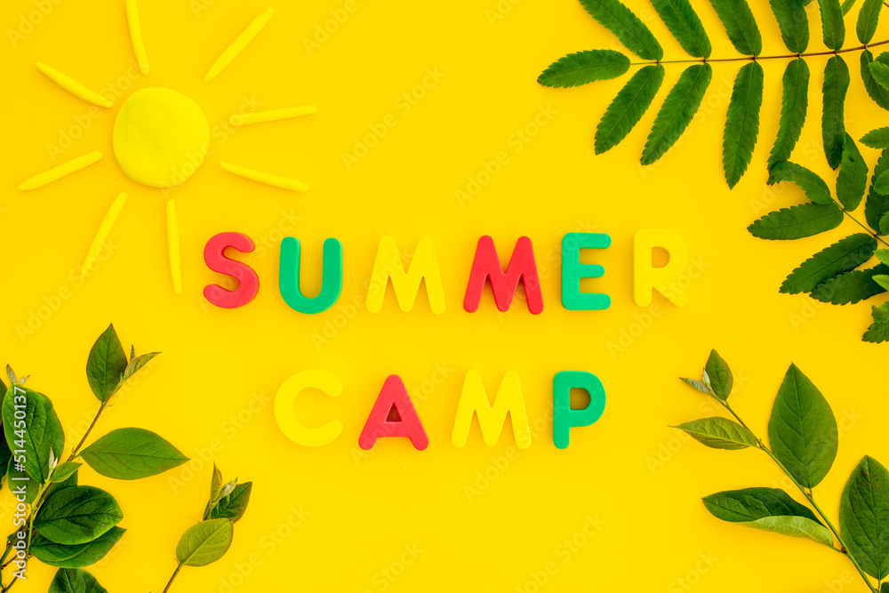 Summer hike concept. Text Summer Camp with green tree branches Summer hike concept. Text Summer Camp with green tree branches