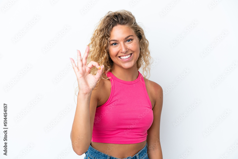 Girl with curly hair isolated on white background showing ok sign with fingers Girl with curly hair isolated on white background showing ok sign with fingers