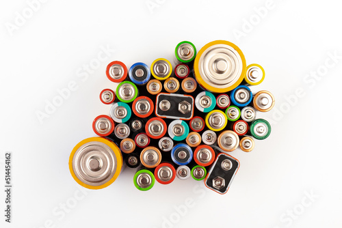 Composition with alkaline batteries on white background. Chemical waste. Top view.