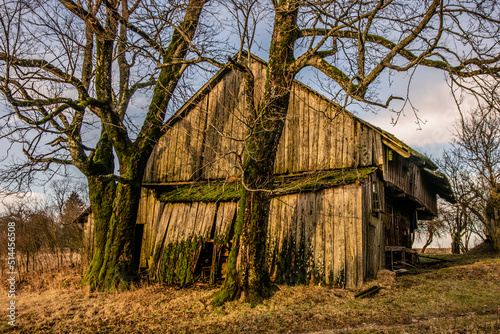 Old abandoned wooden barn in countryside