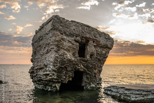 Old abandoned concrete bunker in the sea