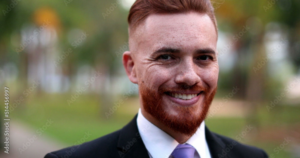 Business man standing outside portrait smiling. Handsome ginger redhead executive Business man standing outside portrait smiling. Handsome ginger redhead executive