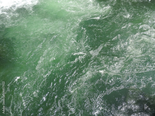 Water surface with strong currents close up texture