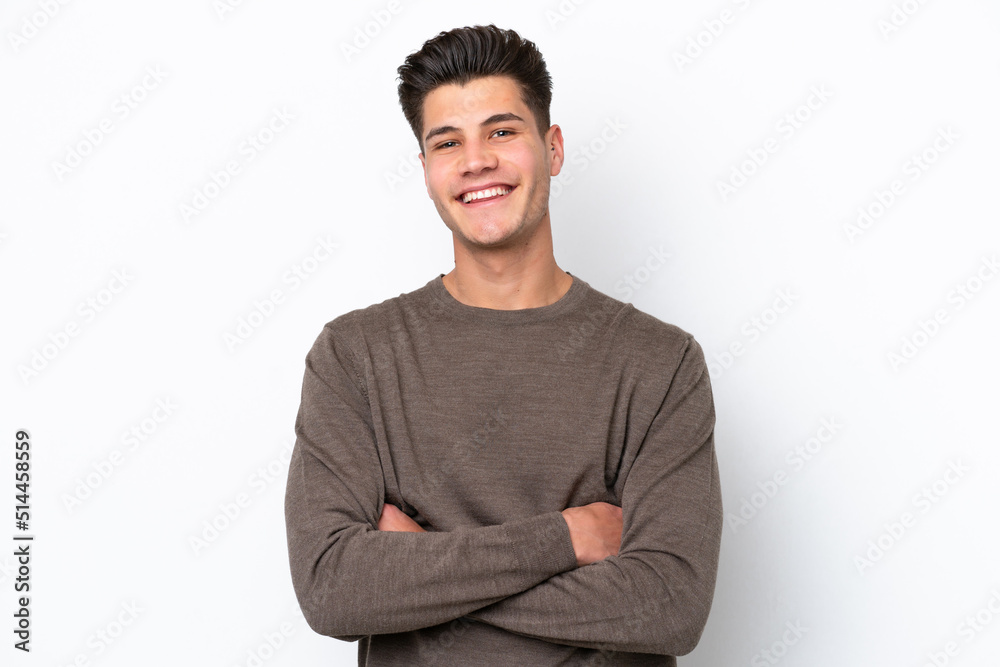 Young handsome caucasian man isolated on white bakcground keeping the arms crossed in frontal position Young handsome caucasian man isolated on white bakcground keeping the arms crossed in frontal position