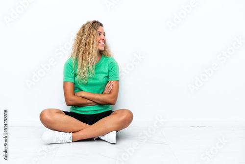 Wallpaper Mural Girl with curly hair sitting on the floor in lateral position Torontodigital.ca