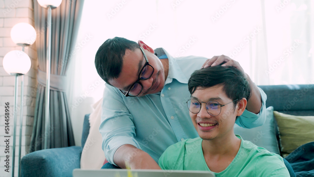 The two male couples are working together on a laptop computer, giving advice on work, with their lover with a serious expression on their faces, The love, and friendship of LGBTQ couples. The two male couples are working together on a laptop computer, giving advice on work, with their lover with a serious expression on their faces, The love, and friendship of LGBTQ couples.