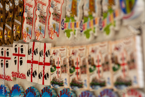 Close up of Italian Magnet Souvenirs Collection reporting local (Sardinian) symbols on Blurred Background
