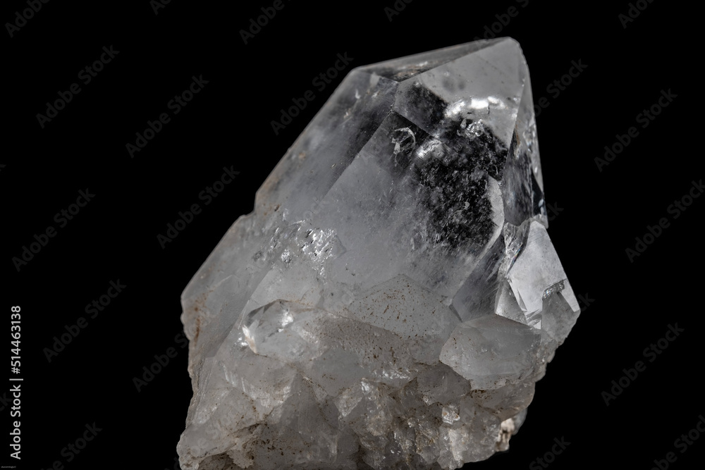 clear quartz crystal on black background