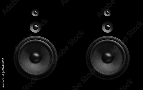 Pair of black speakers close-up. Bass and tweeter in one speaker.