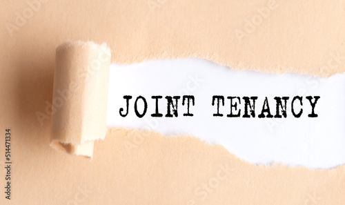 The text JOINT TENANCY appears on torn paper on white background.