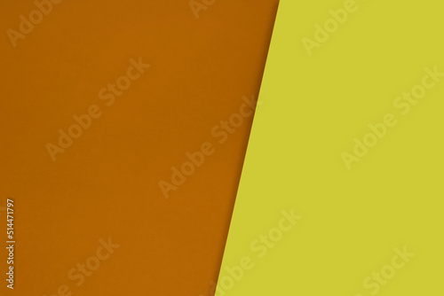 Dark vs light abstract Background with plain subtle smooth de saturated orange yellow colours parted into two