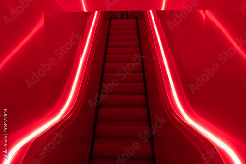 escaleras mecanicas con luz roja photo