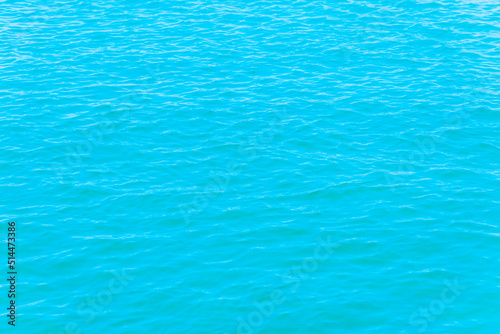 Beautiful turquoise blue sea calm wave summer shot.Banner,copy space.Toned.