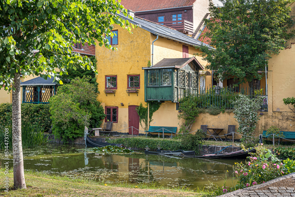 a sunken gondola in a picturesque canal at the town Frederiksværk