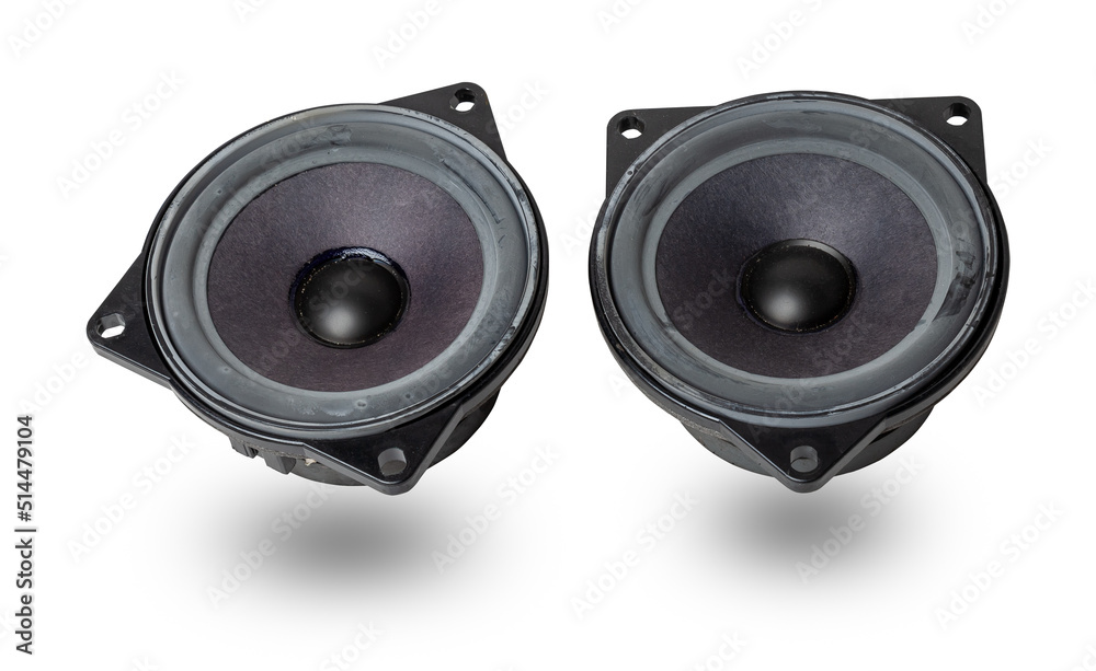 Two speakers of an acoustic system - an audio for playing music in a car interior on a white isolated background in a photo studio. Spare parts for auto repair in a workshop or for sale for tuning. Two speakers of an acoustic system - an audio for playing music in a car interior on a white isolated background in a photo studio. Spare parts for auto repair in a workshop or for sale for tuning.