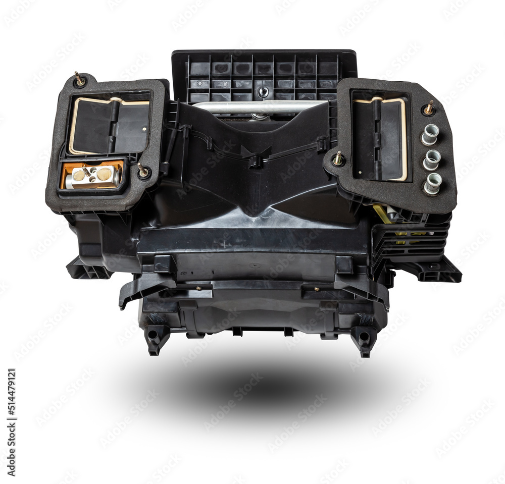The body of the stove heater made of black plastic with an air conditioning system for repair and replacement on a car in a workshop on a white isolated background. Catalog of spare parts for vehicles
