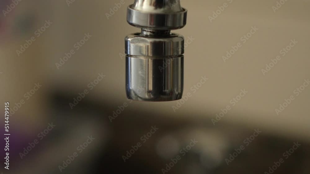 Dripping kitchen faucet macro shot in slow motion Dripping kitchen faucet macro shot in slow motion