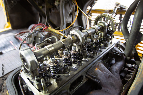 Mercedes diesel engine repair. Hands with a mechanic repairing Mercedes parts. The gas distribution mechanism of the car.