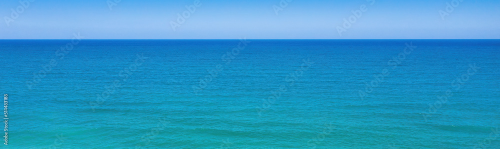 Seascape minimal panoramic background. Clear sky, horizon over blue waves Seascape minimal panoramic background. Clear sky, horizon over blue waves