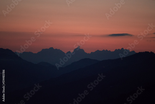 beautiful view of the wilder kaiser in tirol austria at the sunset with red sky
