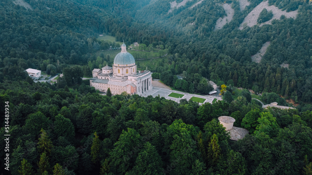 Aerial view of The Sanctuary of Oropa, Roman Catholic building in the Biellese Alps, Northern Italy. Tourist attraction and famous place of pilgrimage in Piedmont. Drone photography. Aerial view of The Sanctuary of Oropa, Roman Catholic building in the Biellese Alps, Northern Italy. Tourist attraction and famous place of pilgrimage in Piedmont. Drone photography.