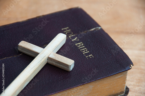 Holy cross on top of Holy bible. Religion and Christianity concept