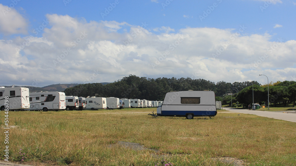 campers and motorhomes fill the parking lot in Foz, Spain campers and motorhomes fill the parking lot in Foz, Spain