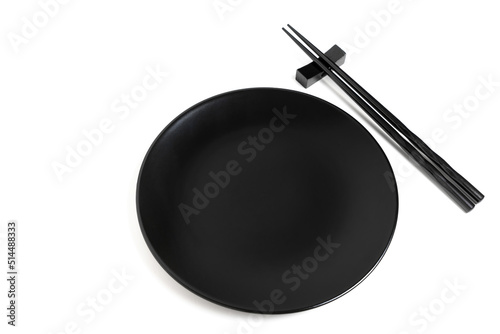 Black chopsticks and black plate on white