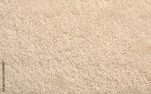 Terry fabric towel copy space background. Beige color.