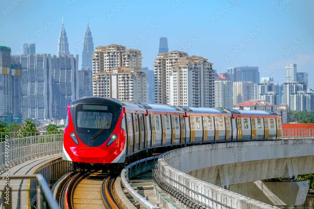 Naklejka premium Malaysia Mass Rapid Transit (MRT) Putrajaya Line train with Kuala Lumpur view