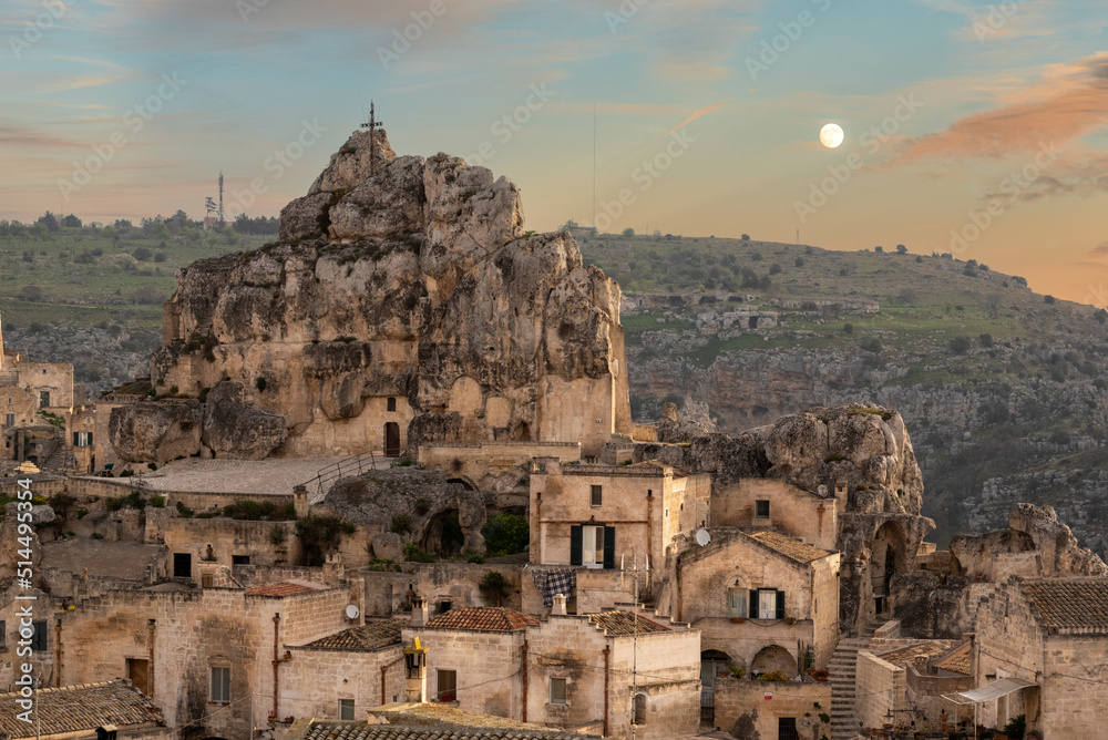 Sunset and full moon over famous cave church of Saint Mary of Idris im Matera, Southern Italy