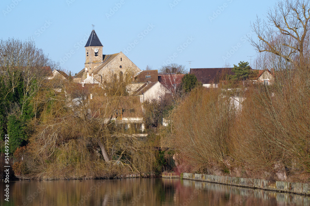 The church of the village of Vert le Petit seen from the ponds