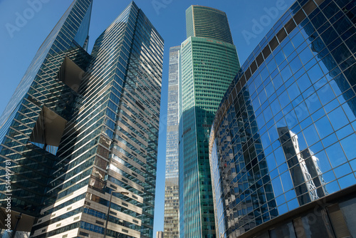 Skyscrapers of the  International Business Center Moscow City reflecting the sun on a autumn day against the blue sky
