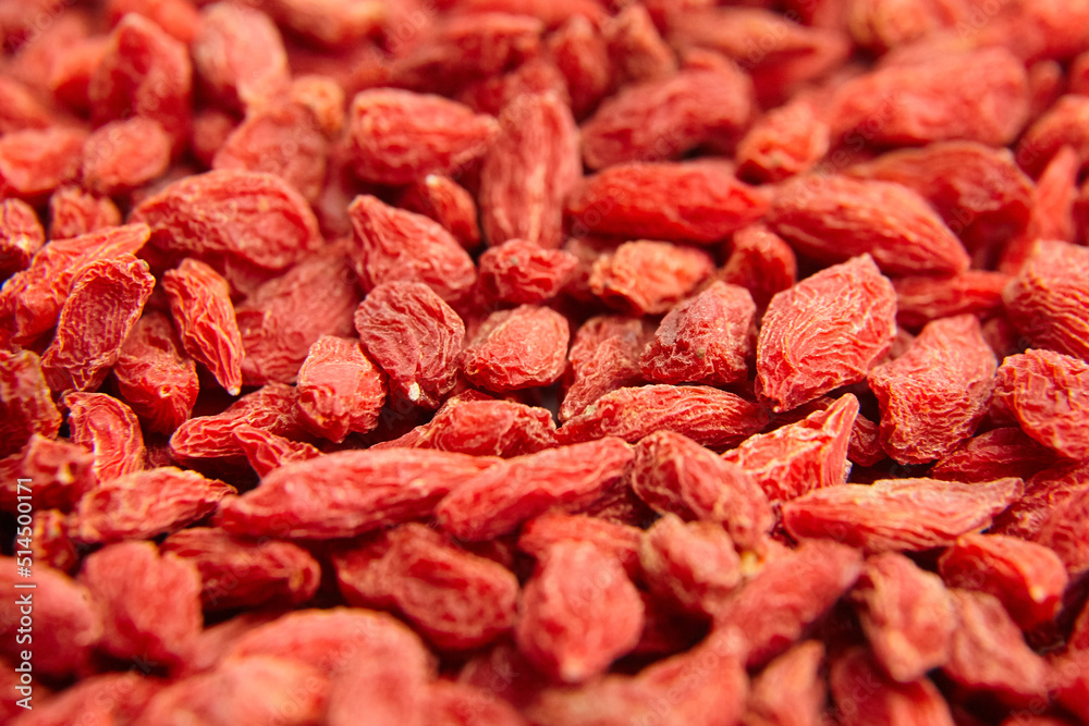 Dried goji berries red background Dried goji berries red background
