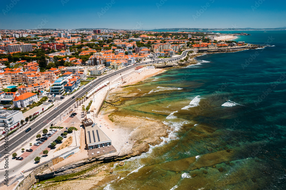 Aerial drone view of Marginal Avenue and coastline with Parade district in Greater Lisbon, Portugal