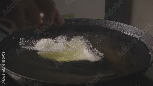 slow motion frying pies in hot oil and serving on a plate