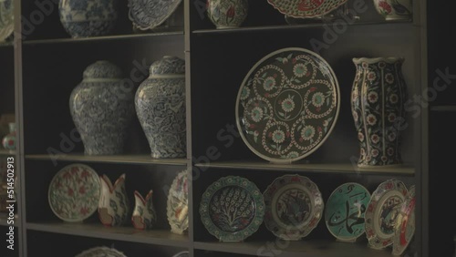 plates displayed in the window of a shop selling handmade ornamental plates