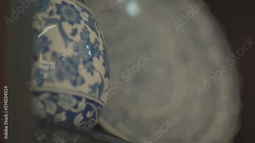 plates displayed in the window of a shop selling handmade ornamental plates