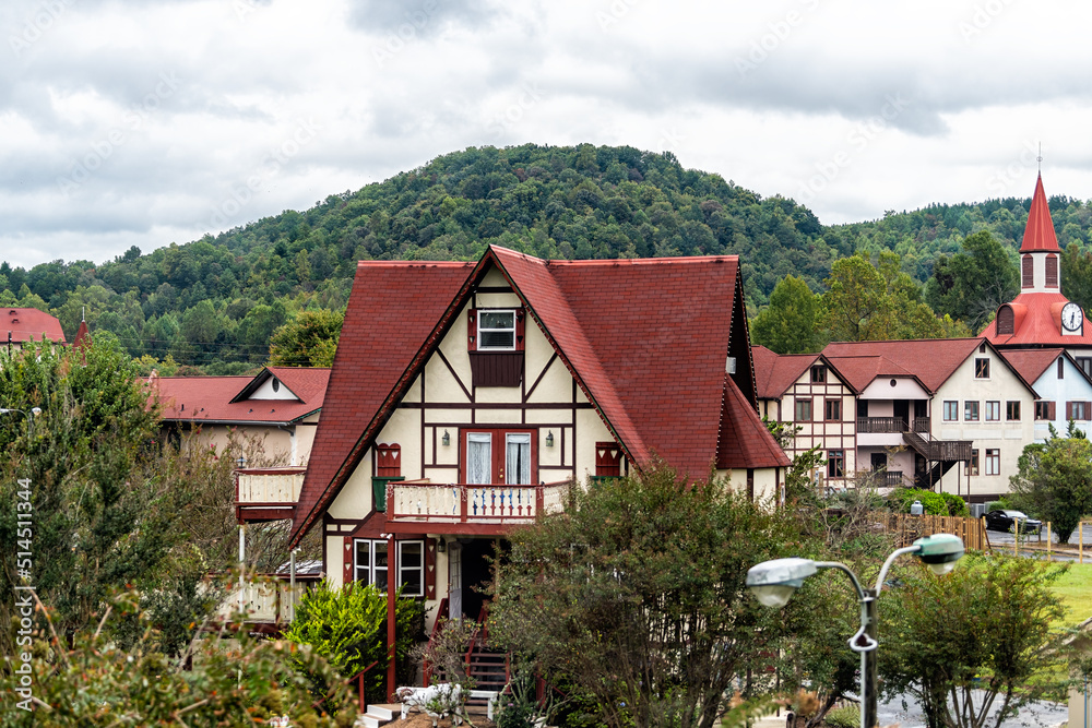 Helen, Georgia Bavarian town cityscape townscape with red roof buildings of German architecture replica with Blue Ridge mountains during Oktoberfest and towers