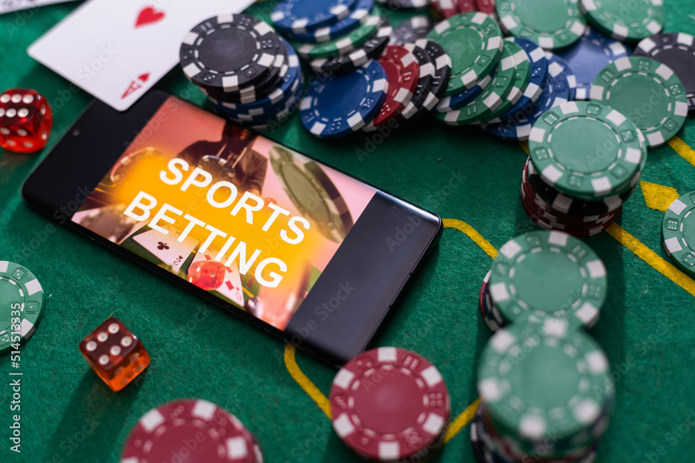 Online poker concept. Smartphone and poker chips on a green background. Poker online banner. Copy space. Vignette. Place for text. Gambling. Background Online poker concept. Smartphone and poker chips on a green background. Poker online banner. Copy space. Vignette. Place for text. Gambling. Background