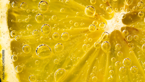  a lemon in soda with bubbles, summer fresh background