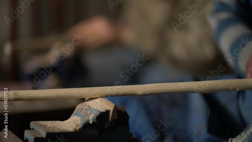 Close-up details of handmade cane master shaping the cane