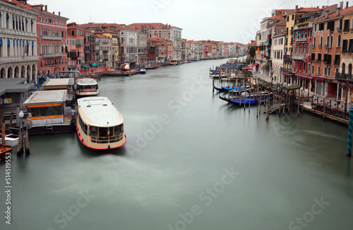 unusual view from the Rialto Bridge in Venice with very few boats and no people with the effect of the long time of photographic exposure during the lockdown in Italy