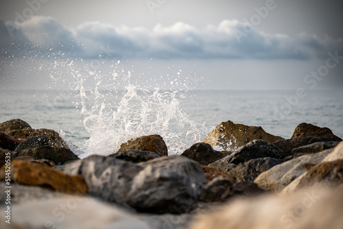 Fototapeta Naklejka Na Ścianę i Meble -  Sea waves lash line impact rock on the beach