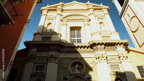 Cathedral of Saint Reparata in Nice. Cathedral of Saint Reparata in the French city of Nice. The facade of the building is decorated with niches and statues of saints. The building is in baroque style photo